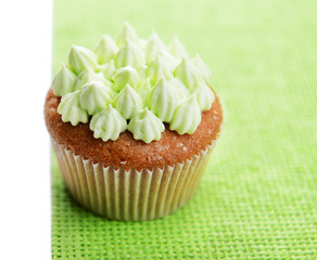 Tasty cupcake with butter cream, isolated on white