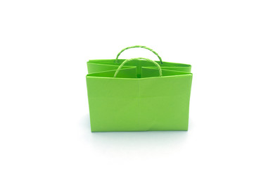 Green paper bag in white background.