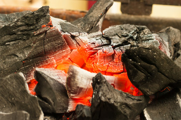 burning charcoal in the background,macro.