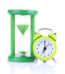 Hourglass and clock isolated on white