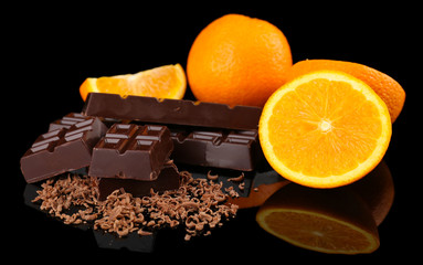 Chocolate and orange on black background