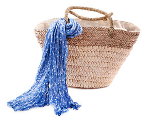 Obraz premium Wicker bag with colorful scarf, isolated on white