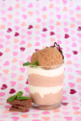 Tasty chocolate mousse with sorbet on bright background