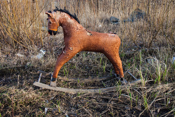 Old thrown away rocking horse