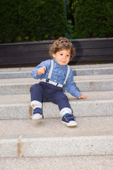 Fototapeta premium Toddler boy trying to descend stairs