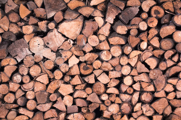 Stacked wood logs background texture