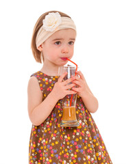 little girl with a glass of juice.