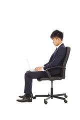 businessman using laptop on the chair