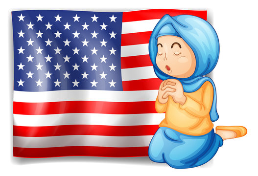 A Muslim praying in front of the USA flag