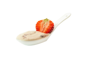 Spoon with strawberry yogurt