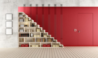 Red Living room with wooden staircase and bookcase © archideaphoto