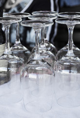 Inverted empty wine glasses on the table, toning