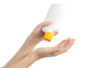 Hands applying sunscreen protection from a bottle