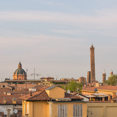 Panoramic view of the roofs of Bologna at sunset.
