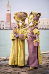Fototapeta na wymiar Carnival of Venice, beautiful masks at St. George island.