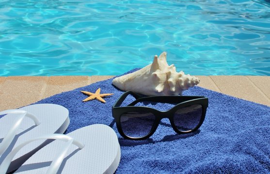 swimming pool towel conch shell starfish shoes sunglasses