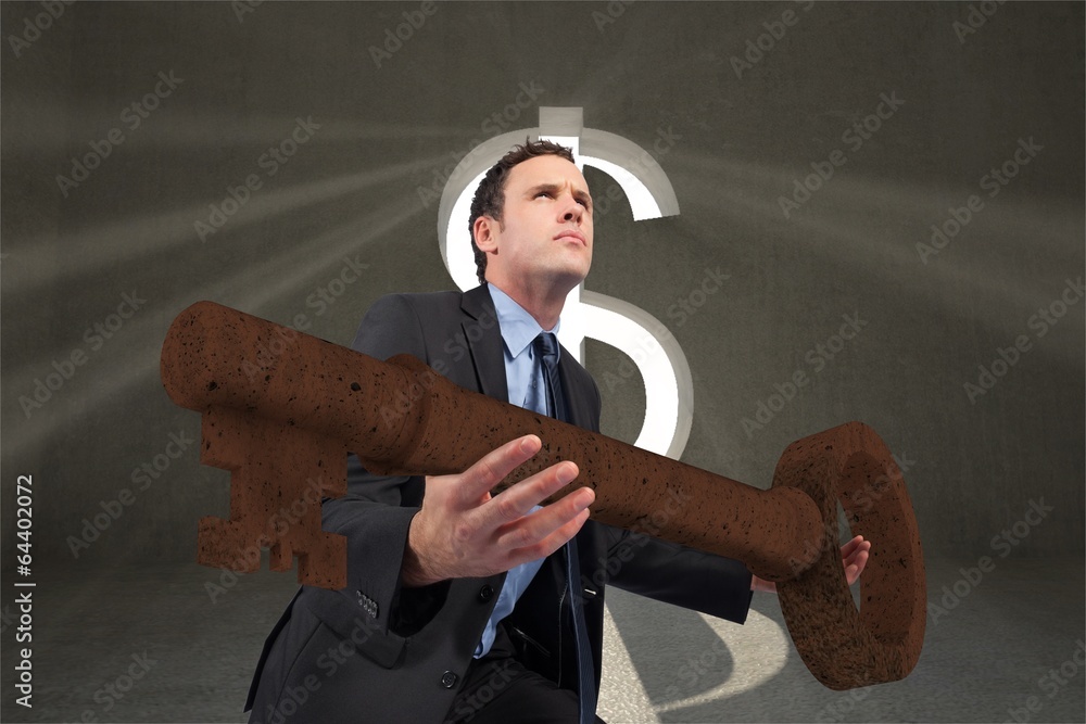 Poster composite image of businessman carrying large key