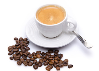 A cup of coffee with coffee beans