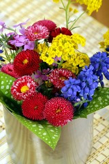spring flowers in metal pot
