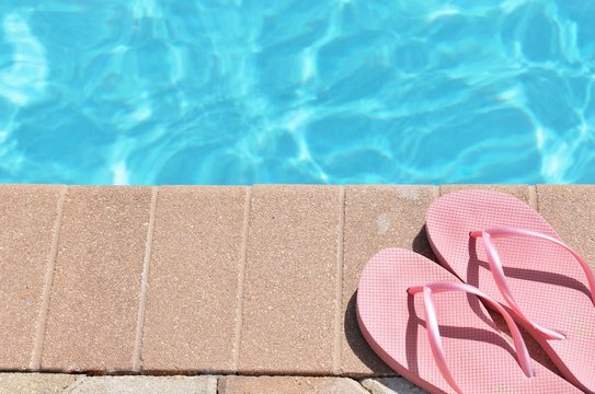 Poolside swimming pool background vacation or travel ban concept holiday vacation scenic flip flops thongs copy space stock, photo, photograph, image, picture, 