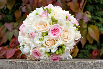 Bouquet of white, pink, cream roses for the wedding ceremony.