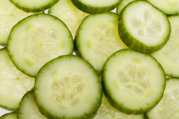 Freshly sliced cucumber  isolated on white background