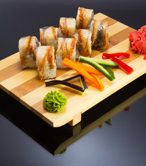 sushi mde dish over black background
