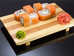 sushi mde dish over black background