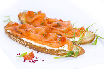 sandwiches with salmon caviar and greens adorned