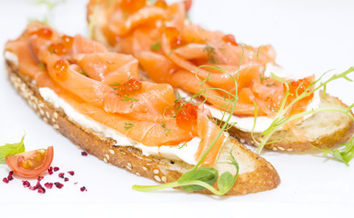 sandwiches with salmon caviar and greens adorned
