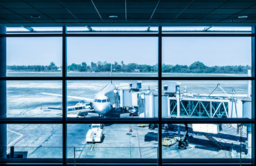 Modern airport with airplane at the terminal gate