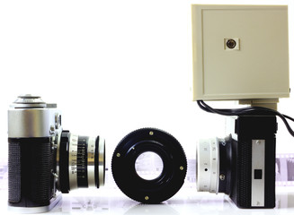 Retro cameras and lens isolated on white