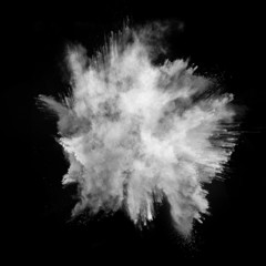 White dust explosions on black background