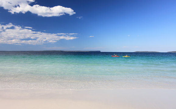 Kayakers enjoy the crystal clear waters Australian Beach