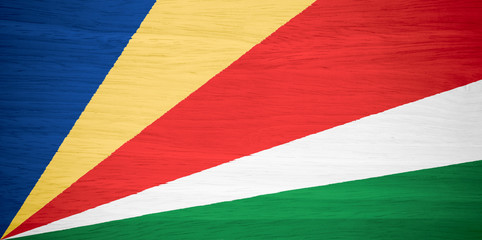 Seychelles flag on wood texture
