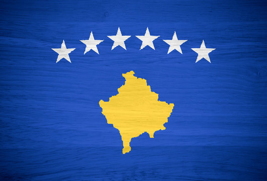 Kosovo flag on wood texture