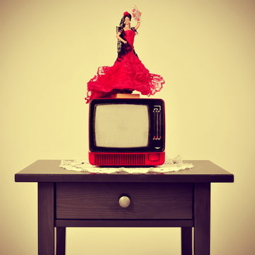 old-fashioned spanish living room, with a flamenca doll in top o