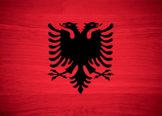 Albania flag on wood texture