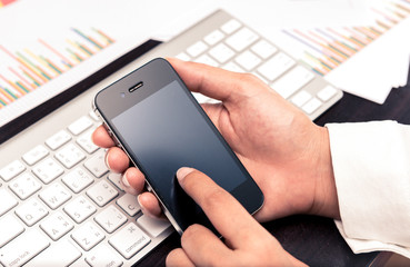 Leader contacting his business team with smartphone