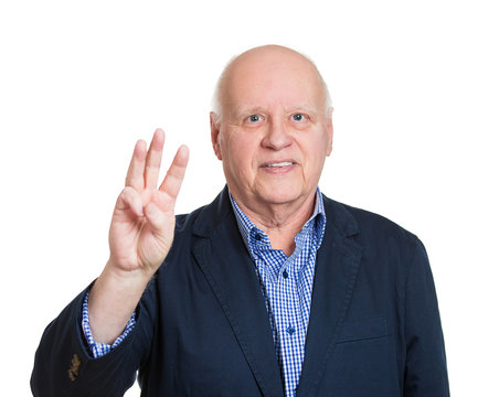 Senior man showing number three hand gesture, white background