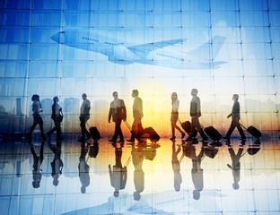 Group of Business Travellers Walking in an Airport