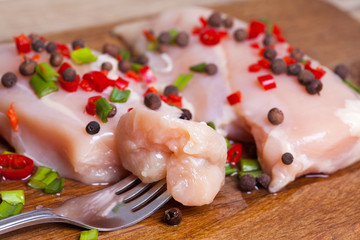 Fresh chicken meat on wooden board