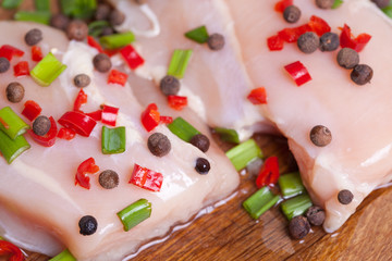 Fresh chicken meat on wooden board