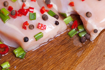 Fresh chicken meat on wooden board