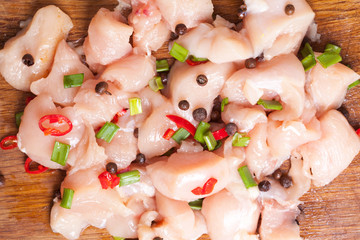 Fresh chicken meat on wooden board