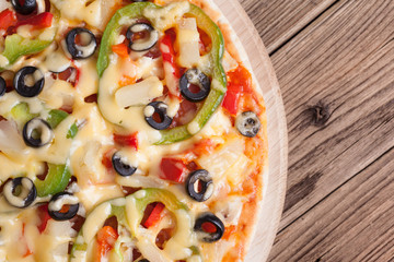 Delicious italian pizza served on wooden table