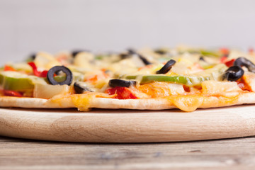 Delicious italian pizza served on wooden table