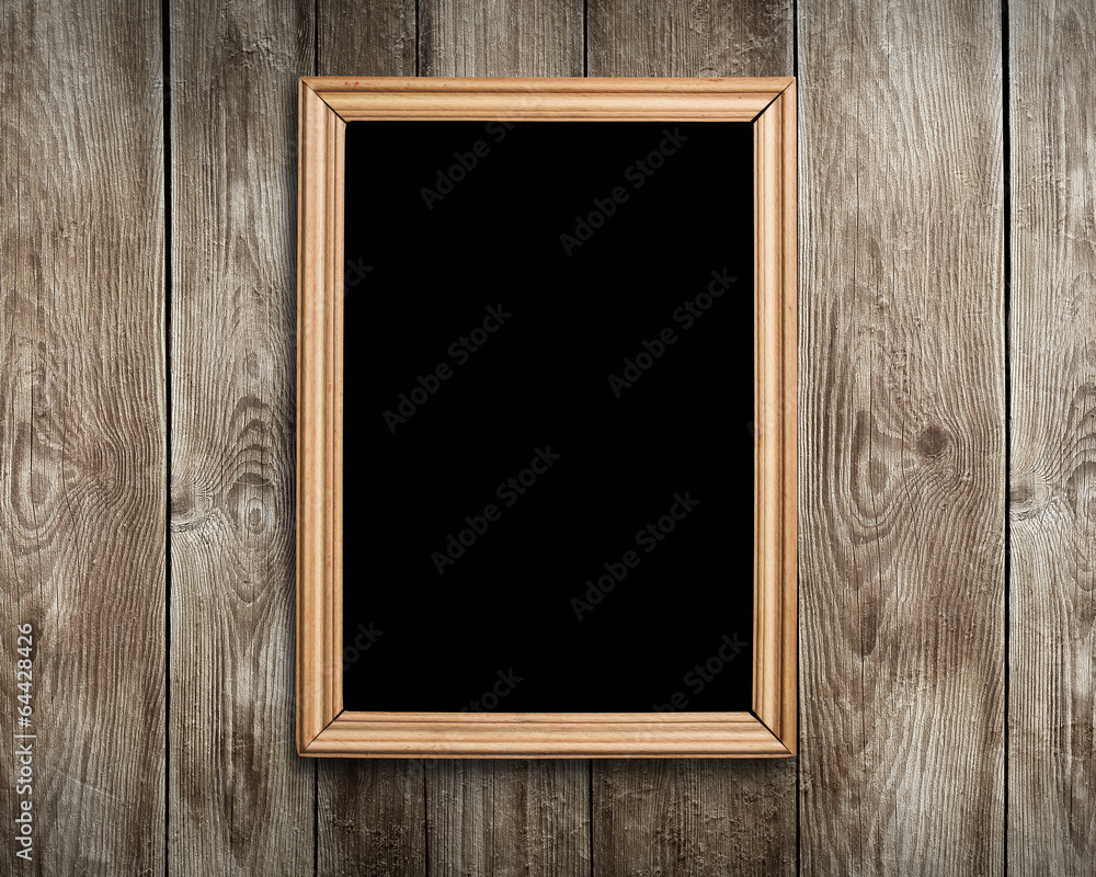 Wall mural Vintage wooden frame on wood background