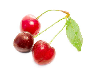 three cherries with leaf