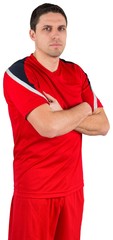Handsome football player looking at camera